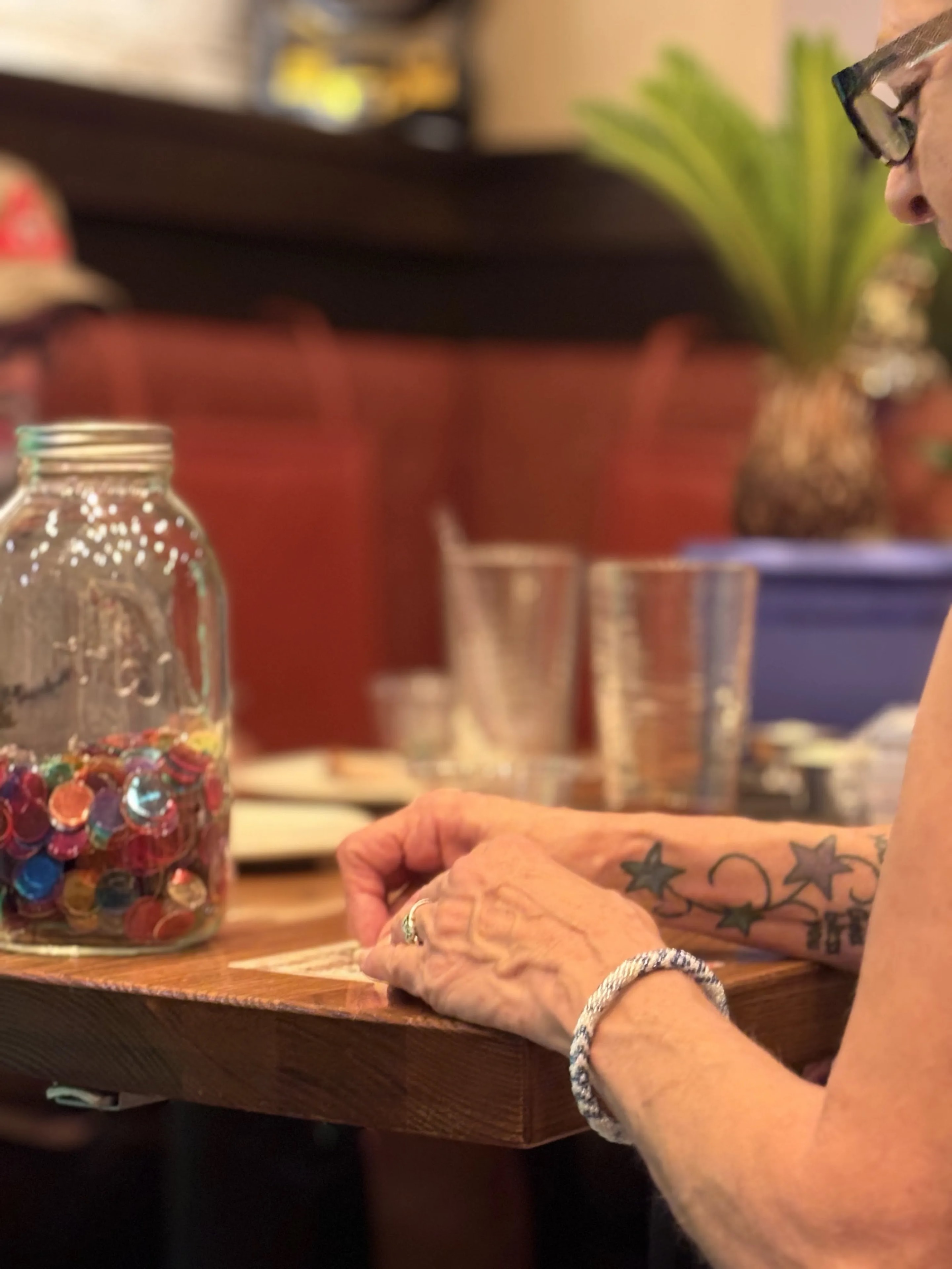 Guest with bingo chips jar at Outback Steakhouse